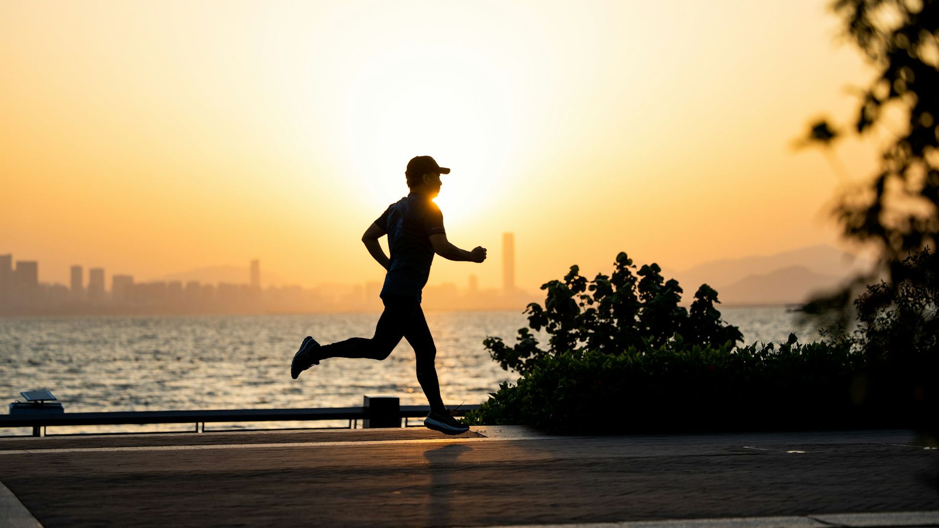 Lone runner silhouetted at sunrise, a reminder that healthy habits can also turn compulsive after recovery