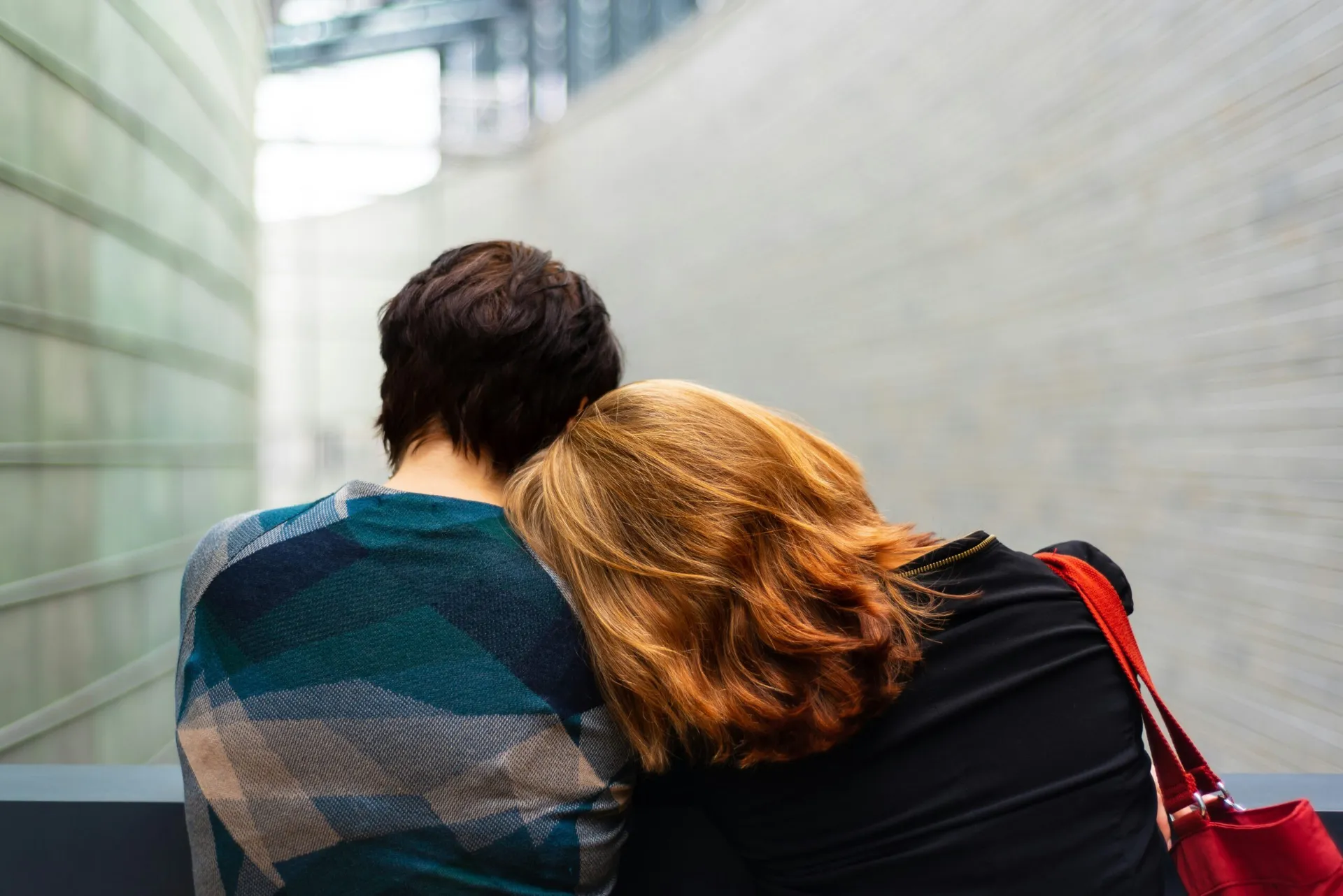 Two people embracing outdoors for comfort and emotional support, illustrating getting a loved one into rehab in Texas